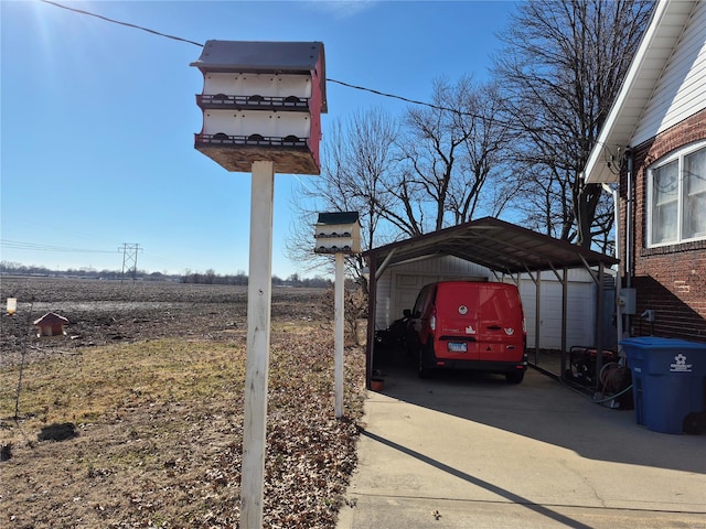 details featuring electric meter and driveway