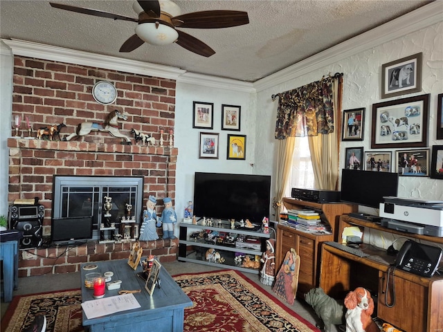 living area with ornamental molding, a fireplace, a textured ceiling, and a ceiling fan