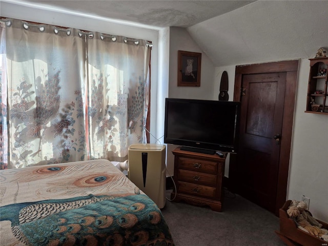 bedroom with lofted ceiling and carpet