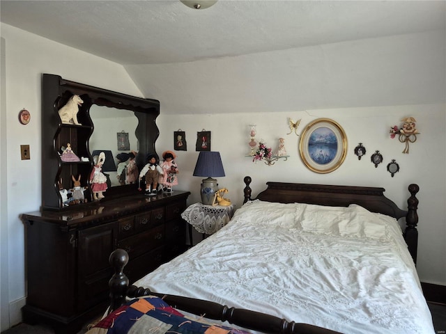 bedroom featuring lofted ceiling