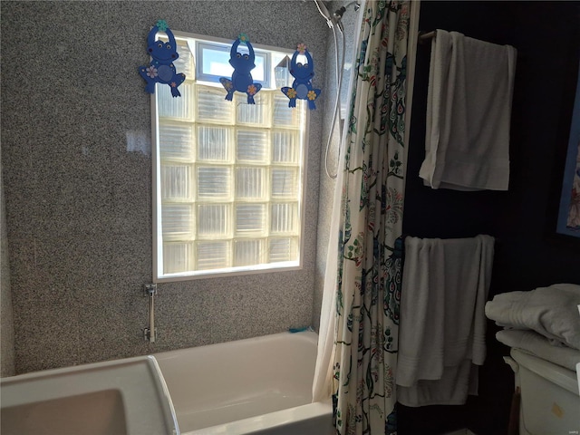 bathroom with shower / tub combo