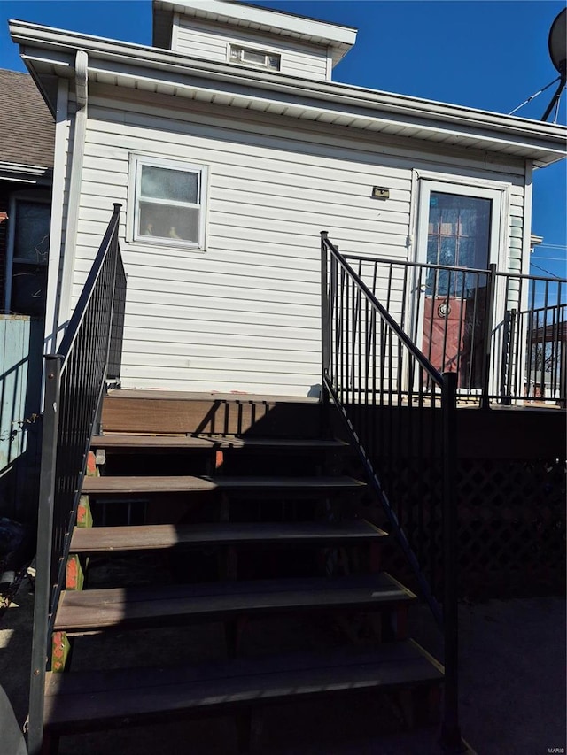 entrance to property with a deck