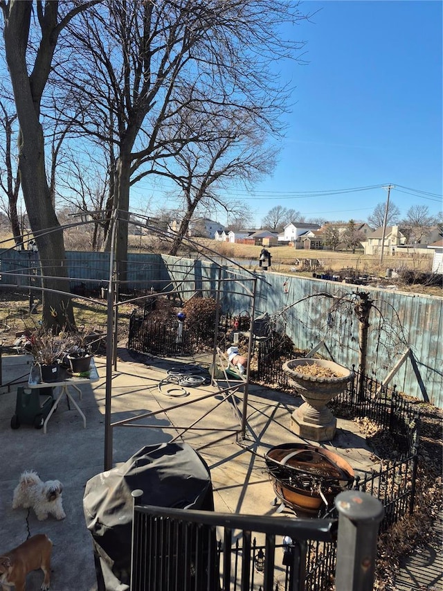 view of patio featuring fence