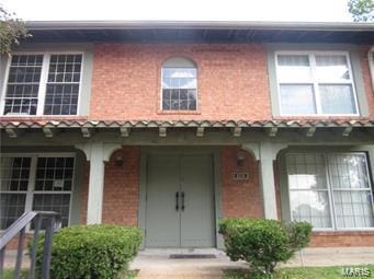 view of front of home with brick siding