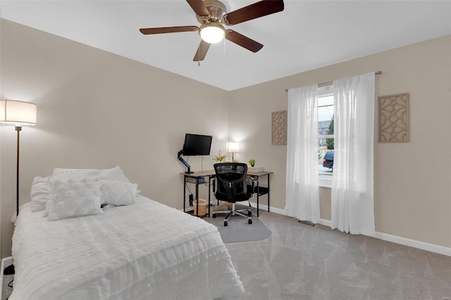 bedroom with carpet flooring, a ceiling fan, and baseboards