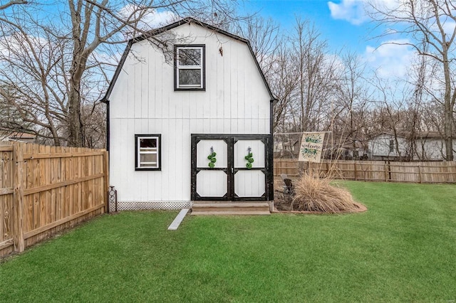 view of outdoor structure with a fenced backyard and an outdoor structure