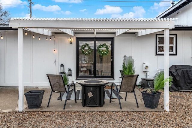 view of patio with a grill and a pergola