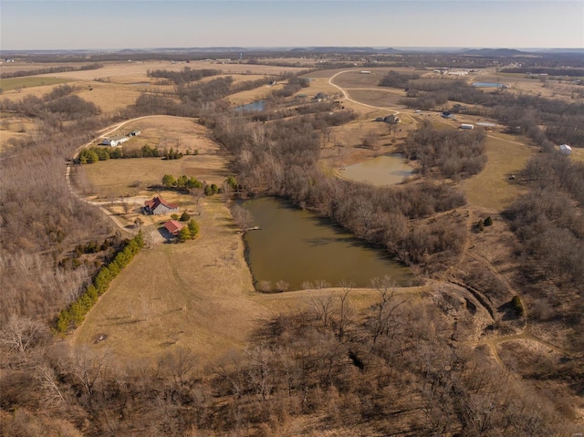 birds eye view of property featuring a rural view and a water view