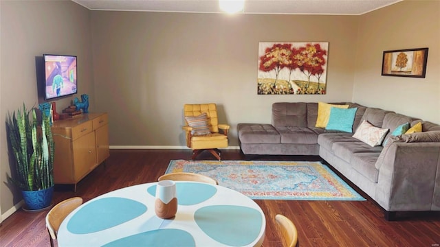 living room with wood finished floors and baseboards