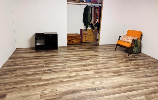 bedroom with a closet and wood finished floors