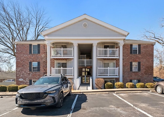 view of property with uncovered parking