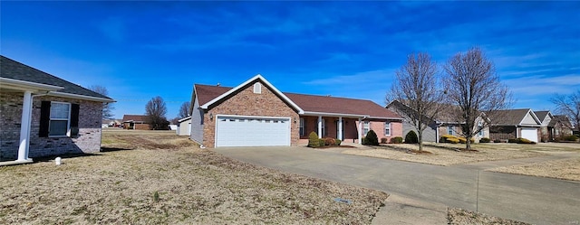 ranch-style house featuring a garage and concrete driveway