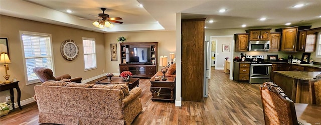 interior space featuring stainless steel appliances, recessed lighting, dark wood-type flooring, and ceiling fan