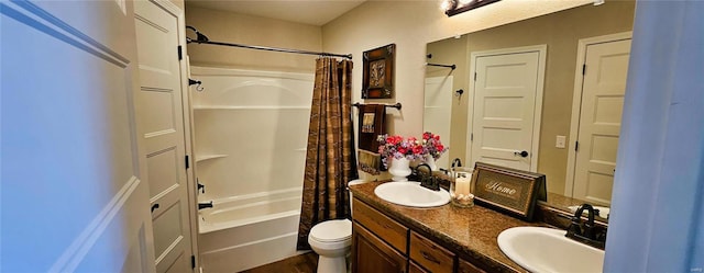 bathroom featuring a sink, shower / bathtub combination with curtain, toilet, and double vanity