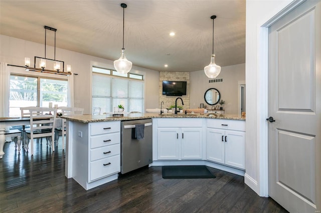 kitchen featuring dark wood-style floors, visible vents, white cabinets, a sink, and dishwasher