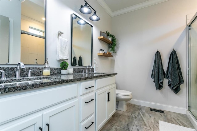 bathroom with baseboards, toilet, a shower with shower door, crown molding, and a sink