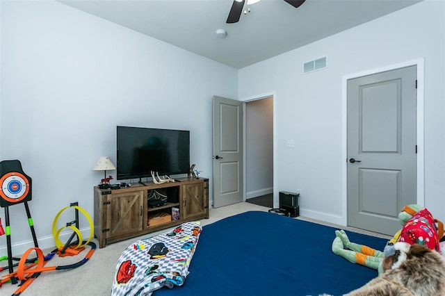 bedroom with carpet floors, visible vents, ceiling fan, and baseboards