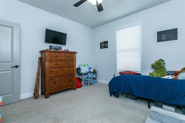 bedroom with ceiling fan, multiple windows, carpet, and baseboards