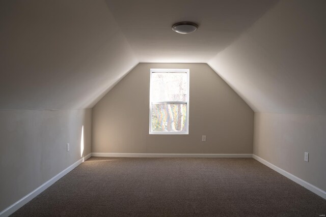 bonus room featuring carpet floors, lofted ceiling, and baseboards