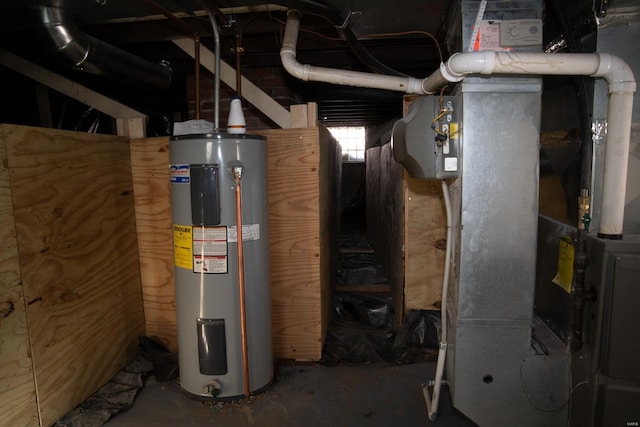 utility room with heating unit and electric water heater