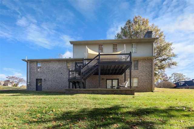 rear view of property featuring brick siding, stairway, a lawn, and a chimney