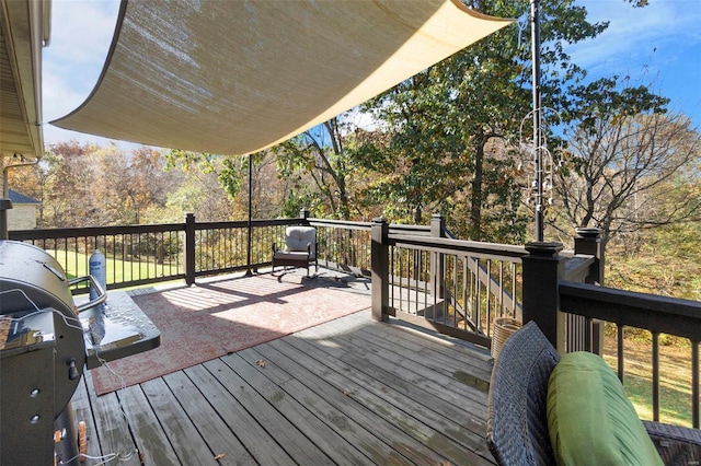 wooden deck with grilling area