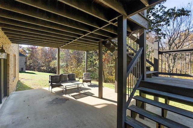 view of patio / terrace with an outdoor living space and stairway