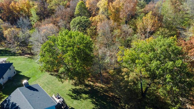 aerial view featuring a wooded view