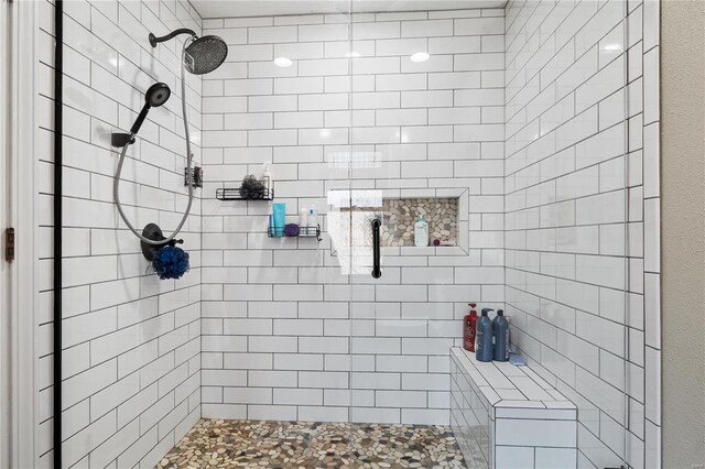 full bathroom with tiled shower