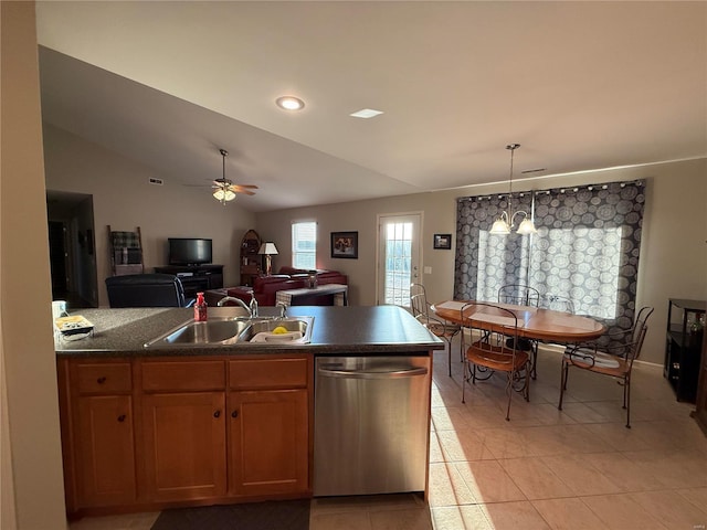 kitchen featuring open floor plan, vaulted ceiling, stainless steel dishwasher, a sink, and ceiling fan with notable chandelier