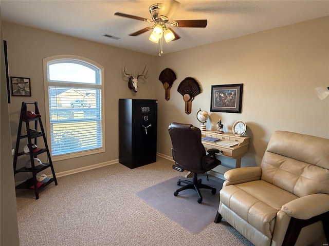 office area with light carpet, baseboards, visible vents, and a ceiling fan