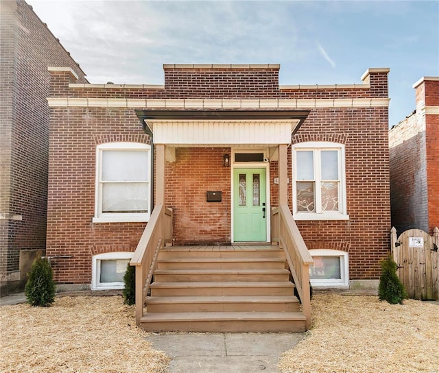 view of front of home with brick siding