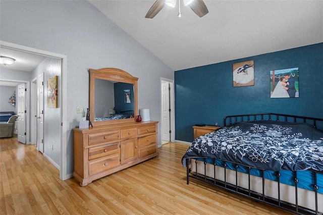 bedroom featuring high vaulted ceiling, ceiling fan, light wood-style flooring, and baseboards