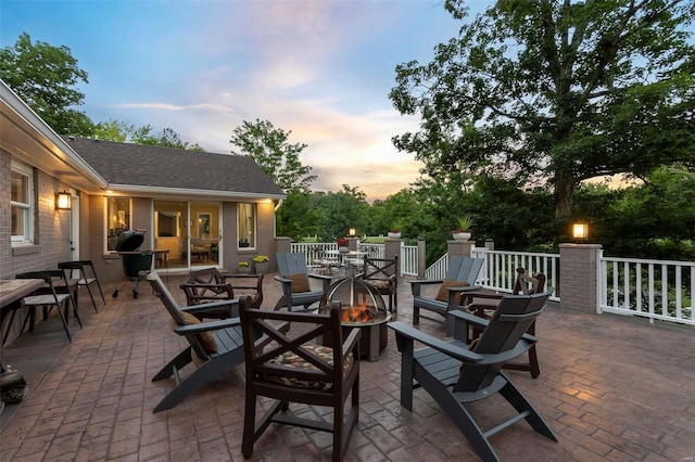 view of patio / terrace with a fire pit