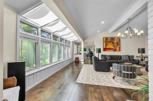 living room with lofted ceiling with beams, an inviting chandelier, hardwood / wood-style floors, and recessed lighting