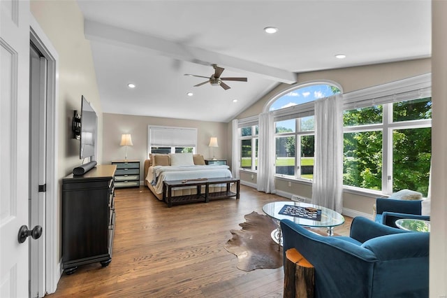 bedroom featuring ceiling fan, lofted ceiling with beams, baseboards, and wood finished floors