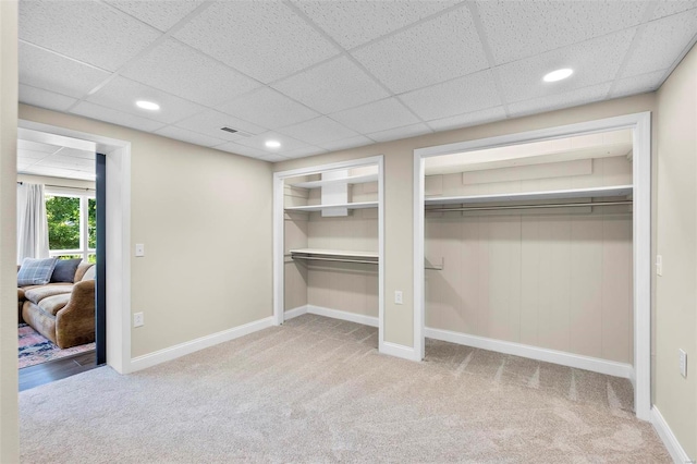 interior space with carpet floors, visible vents, baseboards, and recessed lighting