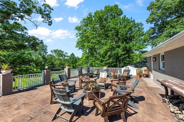 view of patio featuring an outdoor fire pit