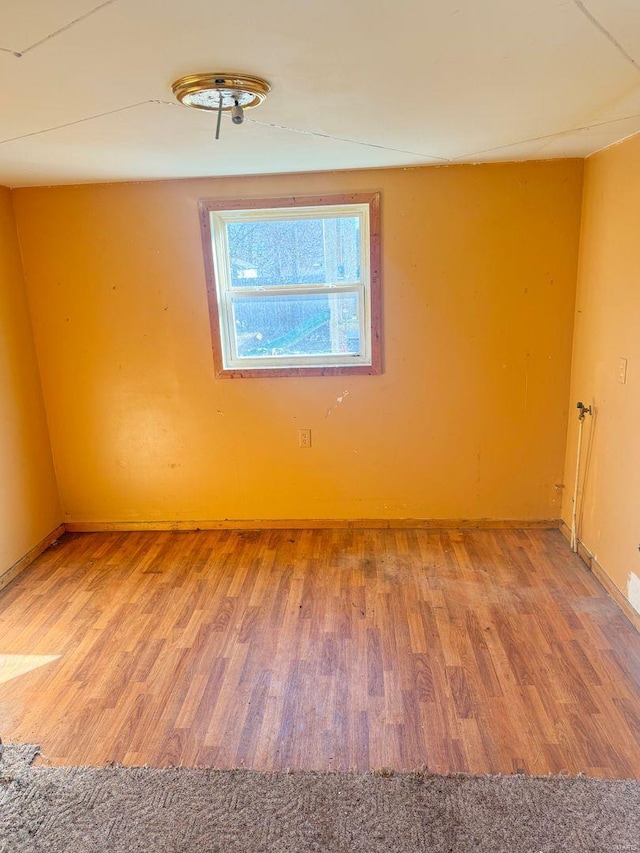 empty room featuring wood finished floors