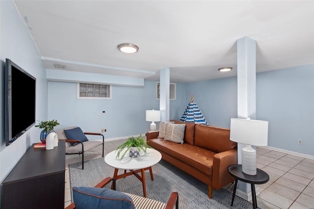 living room with tile patterned flooring and baseboards