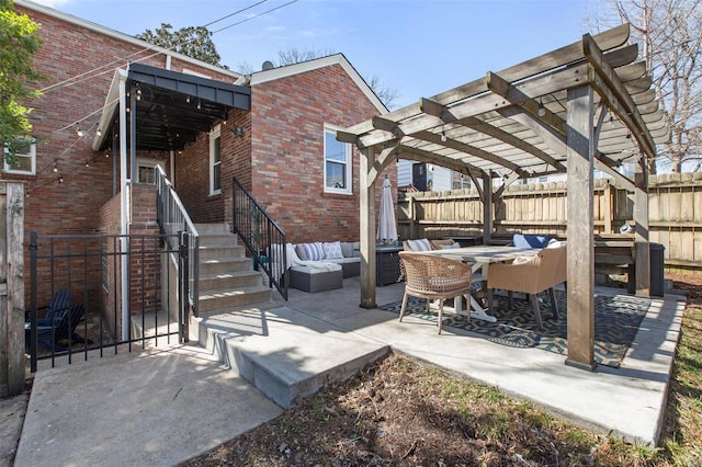 view of patio / terrace with outdoor dining space, fence, a pergola, and an outdoor hangout area