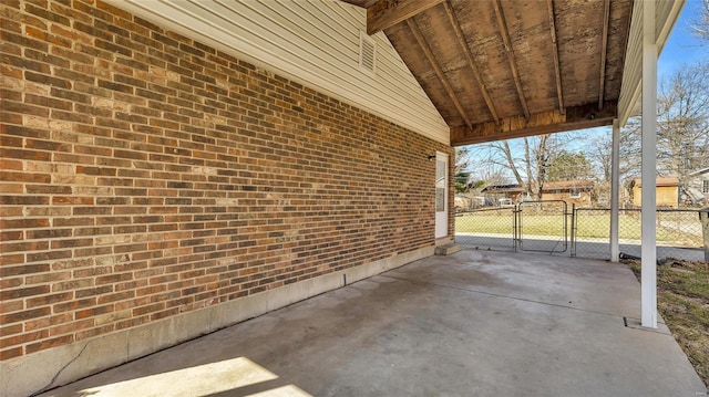 view of patio featuring a gate and fence