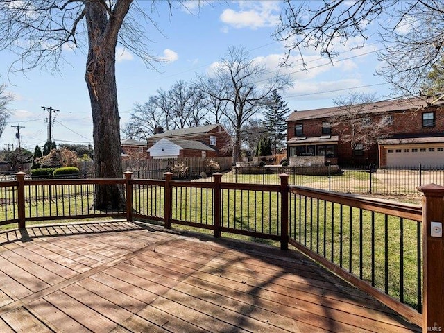 wooden terrace featuring fence private yard and a lawn