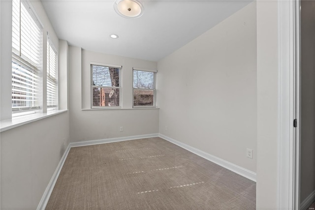 empty room featuring baseboards