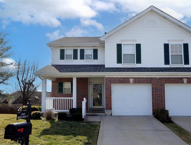 view of front of property featuring a front lawn, driveway, covered porch, a garage, and brick siding