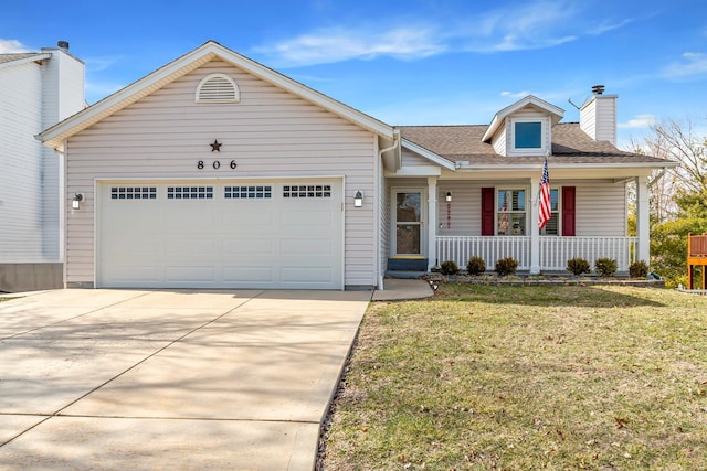 view of front of house with a chimney, covered porch, an attached garage, a front yard, and driveway