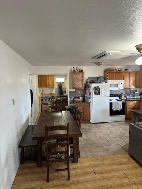 dining area with a textured ceiling