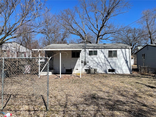 rear view of house with fence