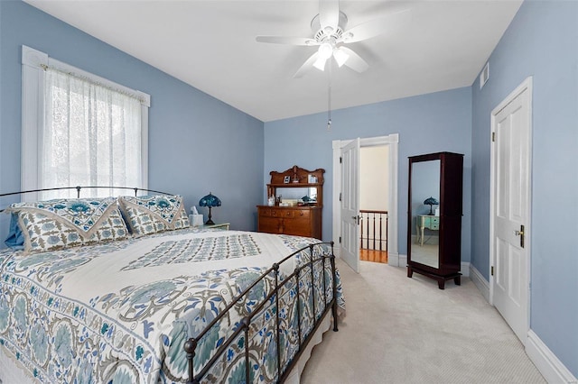 bedroom with a ceiling fan, carpet, visible vents, and baseboards