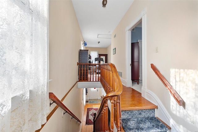 stairway with visible vents and baseboards